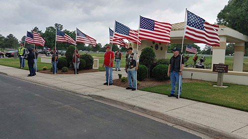 PGR members holding flags in flag line